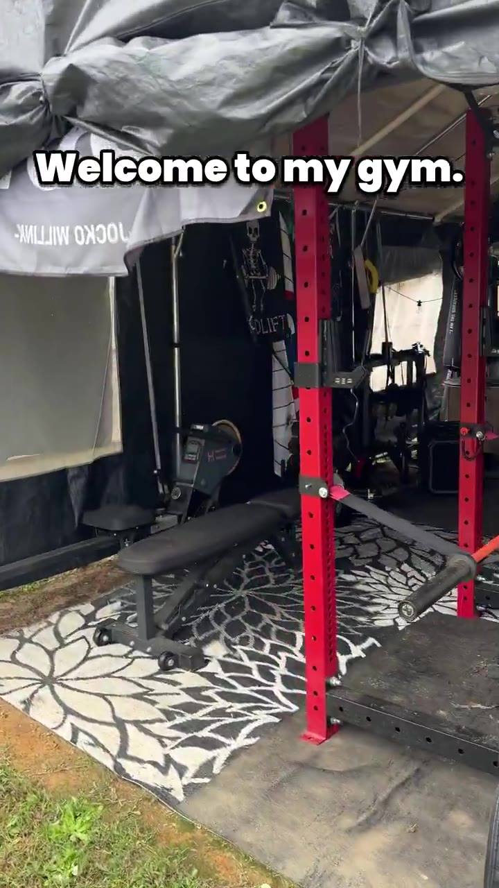 Jenna's backyard home gym with red power rack and bench